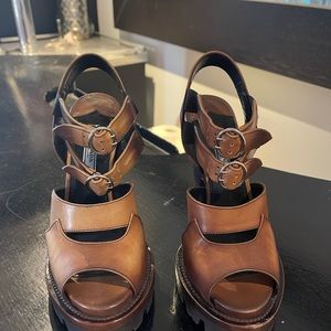 Prada leather gladiator platform sandals. Worn a couple of times.